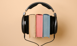 Image shows three books and a headset