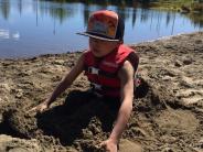 Daubenspeck playing in the sand.