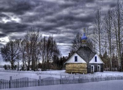 Russian Church in winter with clouds and snow.